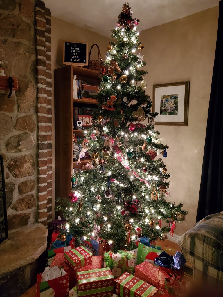 Christmas tree lit up with one missing section